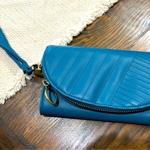 Spacious sized wallet/wristlet. Multiple compartments. NWOT